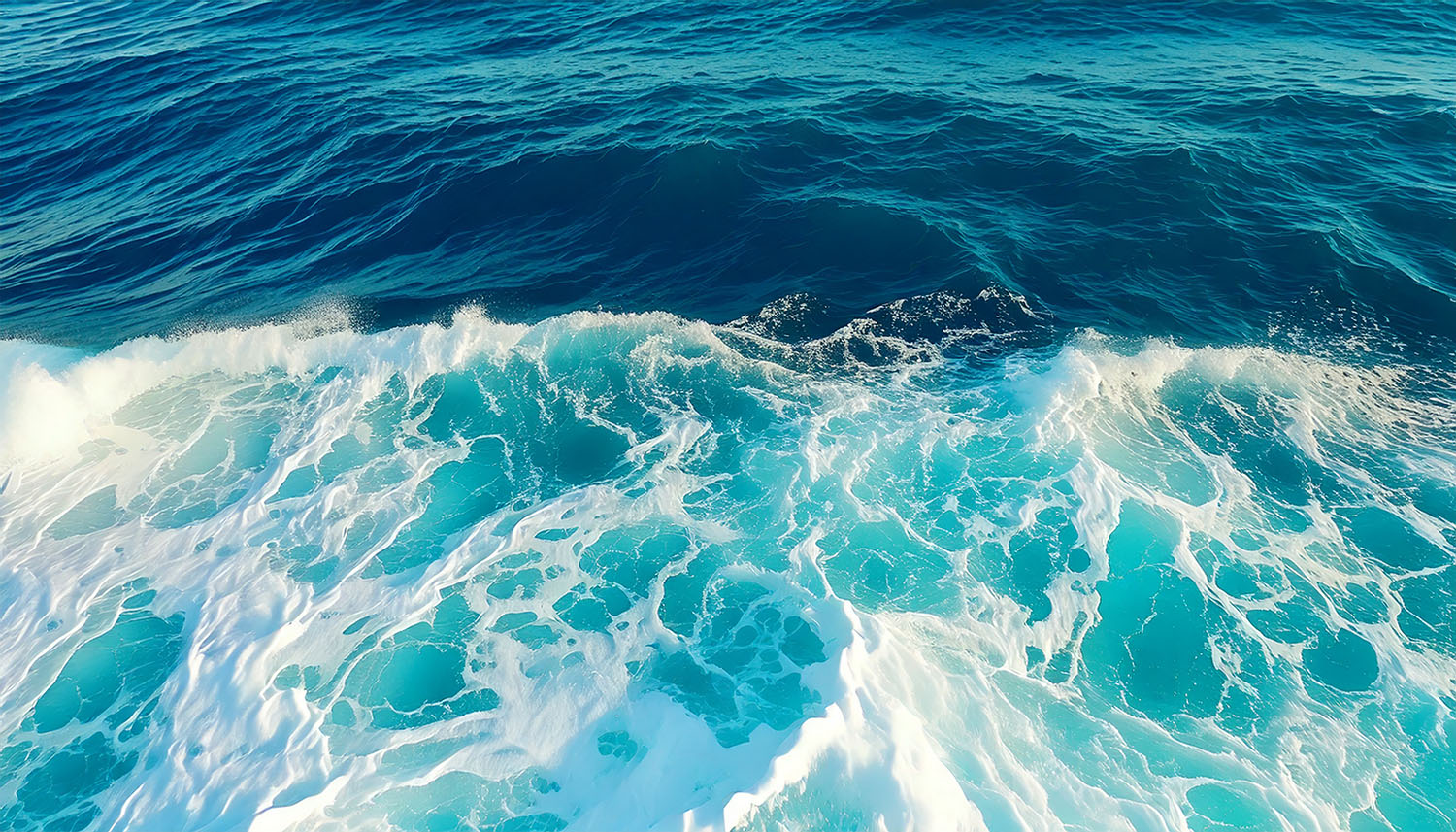 Ocean waves with white foam.