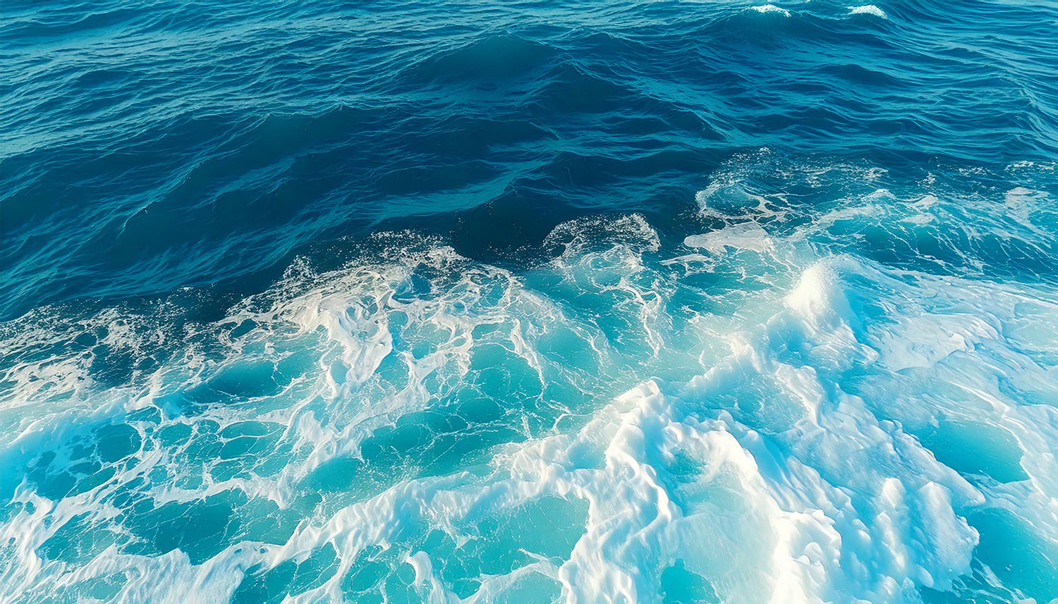 Ocean waves with white foam.