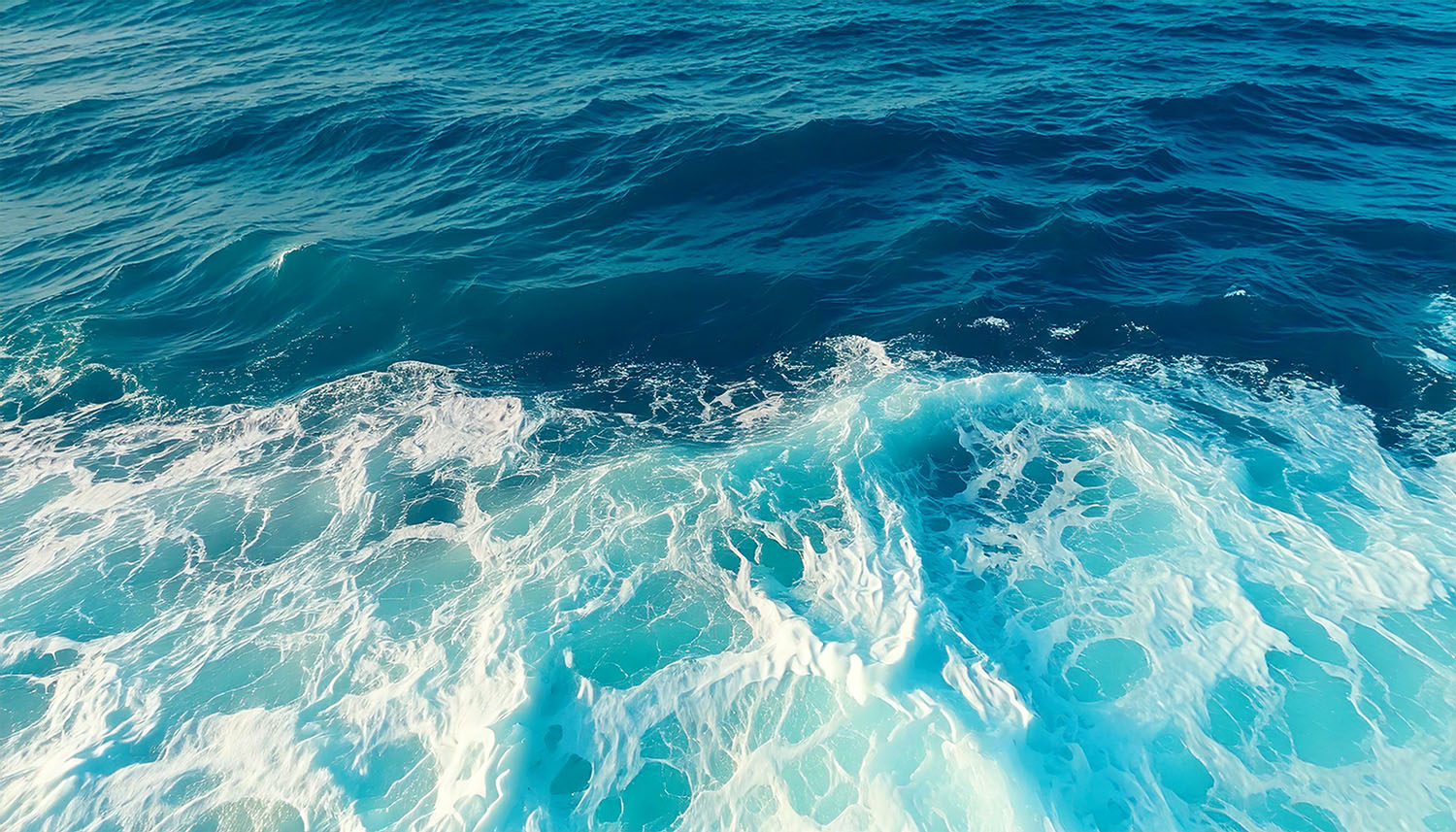 Ocean waves with white foam.